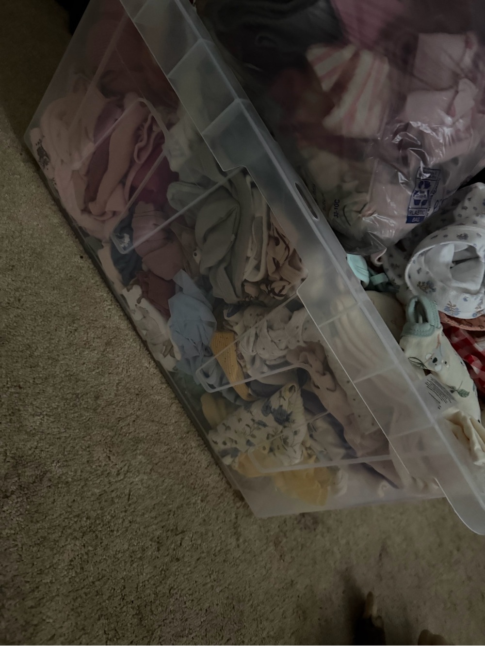 Large tote of baby clothes and swaddles